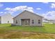 Spacious backyard featuring lush lawn and patio area, perfect for outdoor entertaining at 101 Shelfit Trl, Oxford, NC 27565