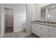 Bathroom with granite countertop vanity and a view to the toilet and walk-in closet at 101 Shelfit Trl, Oxford, NC 27565
