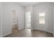 Entryway with access to the bath and bedroom showcases streamlined doors and wood-look flooring at 101 Shelfit Trl, Oxford, NC 27565
