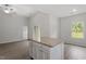 Kitchen island with granite countertop and white cabinets, complementing the open layout at 101 Shelfit Trl, Oxford, NC 27565
