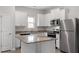 Well-equipped kitchen featuring stainless steel appliances, granite countertops, and a center island at 101 Shelfit Trl, Oxford, NC 27565