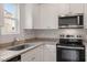 Modern kitchen showcasing granite countertops, stainless steel appliances, and ample cabinet space at 101 Shelfit Trl, Oxford, NC 27565