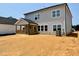 The backyard features a covered porch and fresh landscaping at 108 N Stonemill Trl # Homesite 254, Wilson's Mills, NC 27520