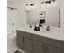 Bathroom with double vanity, tiled floors, and shower at 108 N Stonemill Trl # Homesite 254, Wilson's Mills, NC 27520