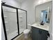 Clean bathroom featuring a walk-in shower, vanity with modern fixtures, and a white quartz countertop at 108 N Stonemill Trl # Homesite 254, Wilson's Mills, NC 27520