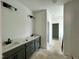 A well-lit bathroom with double sinks and modern fixtures at 108 N Stonemill Trl # Homesite 254, Wilson's Mills, NC 27520