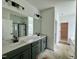 Bathroom featuring a double vanity with modern fixtures and a walk-in shower at 108 N Stonemill Trl # Homesite 254, Wilson's Mills, NC 27520