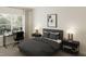 Comfortable bedroom with a large window, a modern desk, and stylish dark furnishings at 108 N Stonemill Trl # Homesite 254, Wilson's Mills, NC 27520