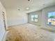 Bedroom with a large window and neutral walls at 108 N Stonemill Trl # Homesite 254, Wilson's Mills, NC 27520