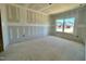 Unfinished bedroom with a large window offering neighborhood views and lots of natural light at 108 N Stonemill Trl # Homesite 254, Wilson's Mills, NC 27520
