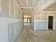 Spacious hallway with neutral walls, leading to various rooms of the home at 108 N Stonemill Trl # Homesite 254, Wilson's Mills, NC 27520