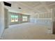 Large living room space featuring multiple windows for natural light at 108 N Stonemill Trl # Homesite 254, Wilson's Mills, NC 27520