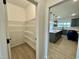 Walk-in pantry with sturdy white wire shelving, offering lots of storage near the kitchen at 108 N Stonemill Trl # Homesite 254, Wilson's Mills, NC 27520