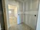 View of a pantry area showing shelving potential and storage space at 108 N Stonemill Trl # Homesite 254, Wilson's Mills, NC 27520