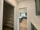 Walk-in pantry with white shelving providing ample storage space, opens to kitchen at 108 N Stonemill Trl # Homesite 254, Wilson's Mills, NC 27520