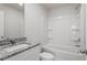 Bathroom with a granite countertop vanity, toilet, and tub-shower combo at 110 Rhino Bnd, Oxford, NC 27565