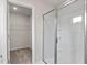 Bathroom featuring a glass door shower and access to the walk-in closet at 110 Rhino Bnd, Oxford, NC 27565