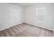 Bright bedroom with neutral carpet, a double door closet, and a window at 110 Rhino Bnd, Oxford, NC 27565