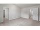 Spacious bedroom boasting plush carpet and doorways to the ensuite bathroom and closet at 110 Rhino Bnd, Oxford, NC 27565