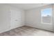 Bright bedroom with neutral carpet, a double door closet, and a window at 110 Rhino Bnd, Oxford, NC 27565
