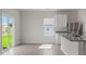 Dining area featuring sliding glass doors to the backyard, seamlessly connected to the kitchen at 110 Rhino Bnd, Oxford, NC 27565
