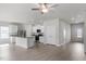 Open-concept kitchen featuring white cabinetry, granite countertops, stainless steel appliances and an island with breakfast bar seating at 110 Rhino Bnd, Oxford, NC 27565