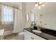Well-appointed bathroom featuring a bathtub, shower, and a sleek vanity at 1115 Wake Forest Rd # B, Raleigh, NC 27604