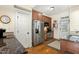 View of the kitchen with stainless steel appliances, wood cabinets and hardwood flooring at 1115 Wake Forest Rd # B, Raleigh, NC 27604