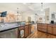 Kitchen with granite countertops, stainless steel appliances, wood cabinets and hardwood flooring at 1115 Wake Forest Rd # B, Raleigh, NC 27604