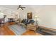 Open-concept living area with hardwood floors, stylish furnishings, and a dining area nearby at 1115 Wake Forest Rd # B, Raleigh, NC 27604