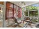 Inviting screened porch with comfortable seating, perfect for relaxation and outdoor enjoyment at 1115 Wake Forest Rd # B, Raleigh, NC 27604