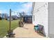 Inviting back patio with comfortable seating, string lights, and a clear view of the yard at 118 Riverwood Dr, Fuquay Varina, NC 27526