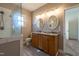 Renovated bathroom with double vanity, granite counters, and modern glass shower enclosure at 118 Riverwood Dr, Fuquay Varina, NC 27526