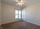 Bright bedroom with plush carpet and large window, offering a serene retreat at 118 Riverwood Dr, Fuquay Varina, NC 27526