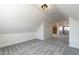 Large bonus room with neutral walls, carpet, and lighting, leads to other rooms in the home at 118 Riverwood Dr, Fuquay Varina, NC 27526