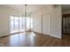Bright dining room with sliding glass doors to a deck, chandelier, and stainless steel refrigerator at 118 Riverwood Dr, Fuquay Varina, NC 27526