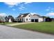 Exterior shot of a home with a lush front lawn, a two-car garage, and shed at 118 Riverwood Dr, Fuquay Varina, NC 27526