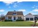 Charming two-story home with a well-manicured lawn, swing, and an attached garage at 118 Riverwood Dr, Fuquay Varina, NC 27526