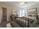 Serene bedroom with soft hues, a comfortable bed, and natural light from double windows at 118 Riverwood Dr, Fuquay Varina, NC 27526