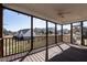 Screened porch with wood floors and a view of the backyard and surrounding neighborhood at 118 Riverwood Dr, Fuquay Varina, NC 27526