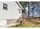 Back entrance with wooden steps, white siding, and a convenient access point to the home at 120 W College St, Oxford, NC 27565