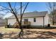 Expansive backyard featuring a wooden deck, vinyl siding, and ample space for outdoor activities at 120 W College St, Oxford, NC 27565