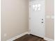 Bright entryway featuring a modern door and hardwood floors at 120 W College St, Oxford, NC 27565