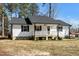 This angle highlights the home's layout, front porch, and easy-to-maintain landscaping at 120 W College St, Oxford, NC 27565