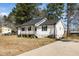 A well-maintained home with a long driveway leading to the front porch at 120 W College St, Oxford, NC 27565