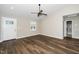 Bright living room with fresh paint, modern flooring, and a ceiling fan at 120 W College St, Oxford, NC 27565
