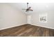 Spacious living room featuring modern flooring and a ceiling fan at 120 W College St, Oxford, NC 27565
