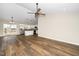 Open concept living area flows into a modern kitchen with stainless steel appliances at 120 W College St, Oxford, NC 27565