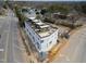 Aerial view of newly built townhouses with gray roof decks and white exteriors at 1310 Chamblee Hill Ct, Raleigh, NC 27608