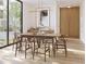 Elegant dining room with wood table and floor to ceiling window at 1310 Chamblee Hill Ct, Raleigh, NC 27608